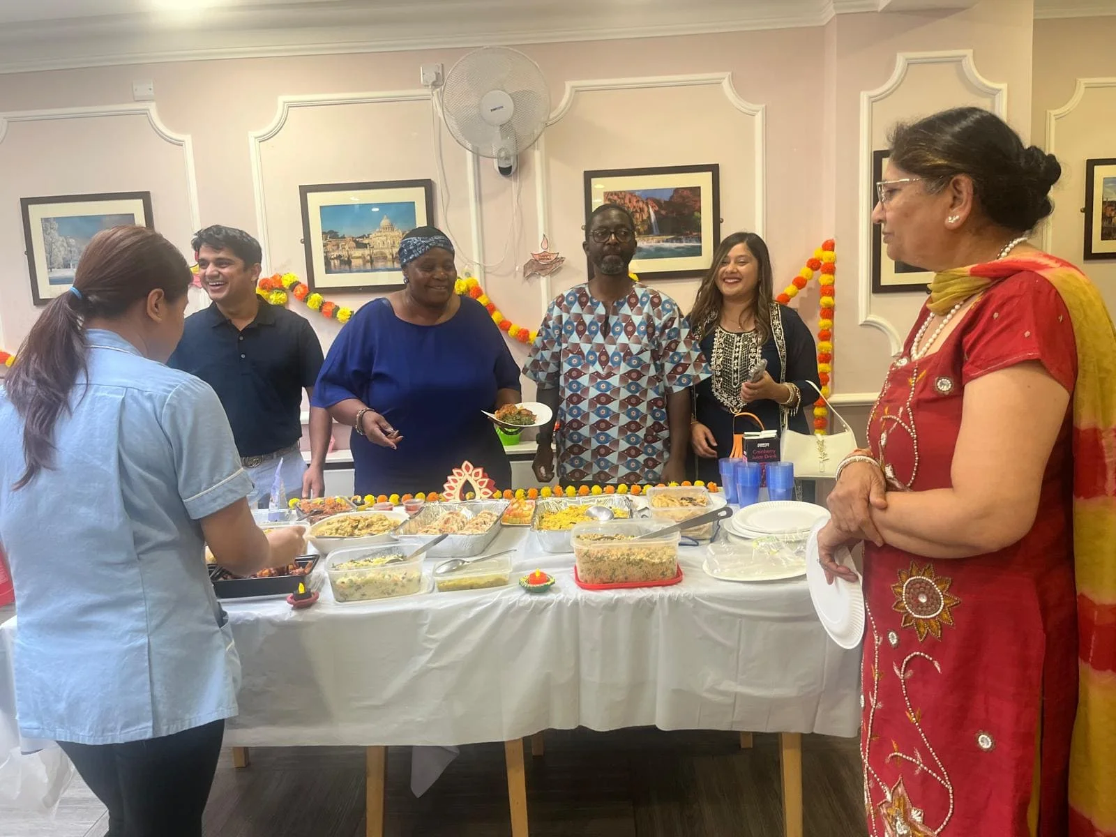 attentive carer helping with day care activities at Abbey Ravenscroft Park Nursing Home