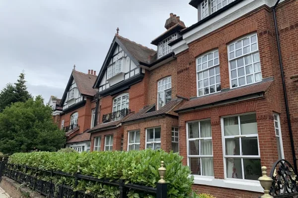 The grand Tudor-style exterior of Abbey Ravenscroft Park Nursing Home in Barnet, North London